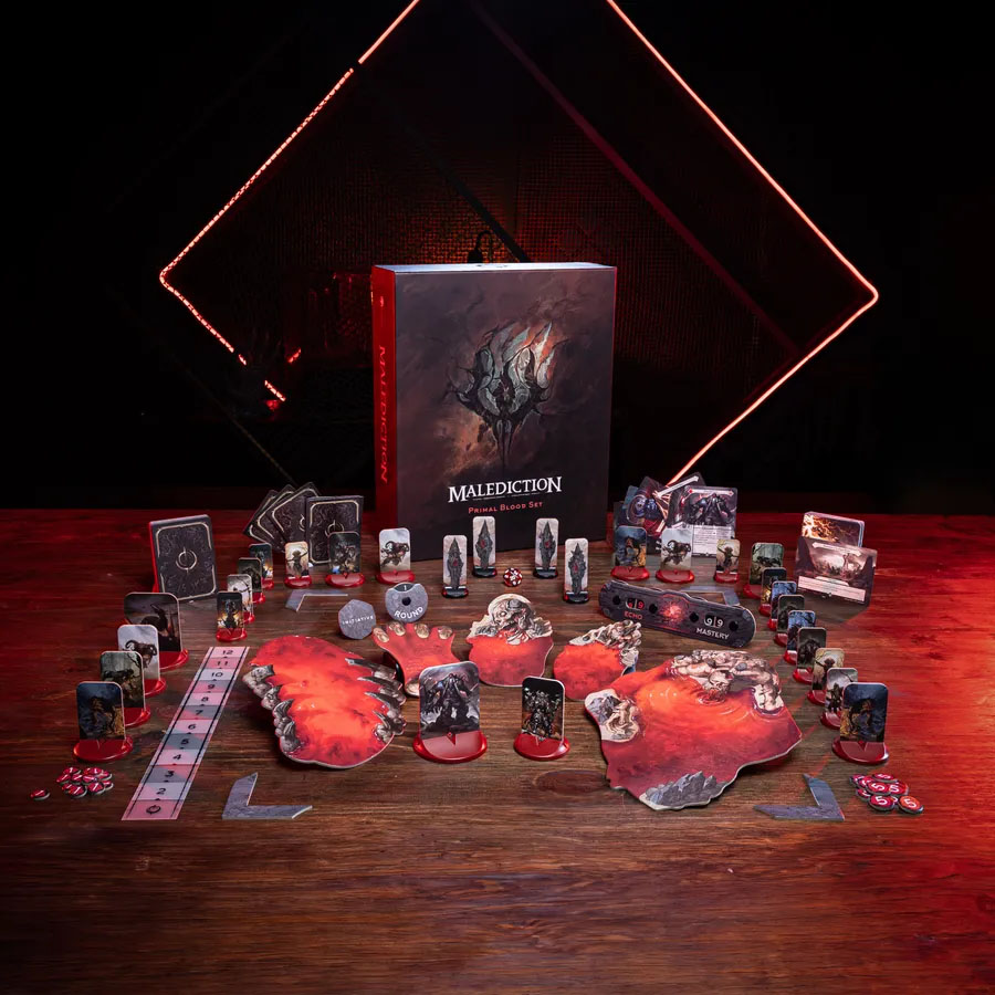 A view of the components for Malediction, including dozens of full-color, red-based standees.