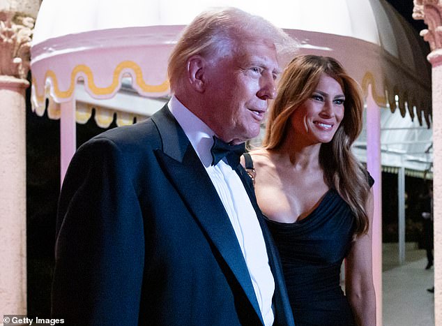 Former and future first lady Melania Trump (right) stood by her husband's side as he spoke to reporters Tuesday evening and again in the ballroom