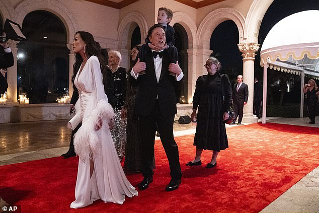 Elon Musk (center) walked the red carpet with toddler X on his shoulders and next to his mother Maye (back left)