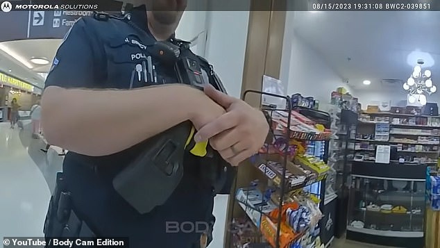 After a store employee told them she had to pay, the officers decided she hadn't caused enough trouble to arrest her for disorderly conduct, but they were heard telling each other to stay close as they predicted they would be called back.