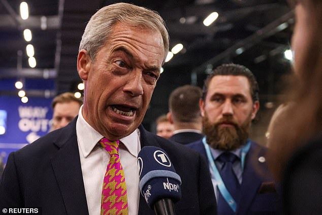 Reform UK party leader Nigel Farage speaks to the media at the Reform UK party's national conference in Birmingham