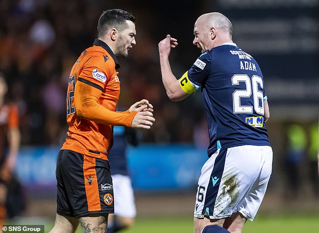 Tony Watt and Charlie Adam exchange pleasantries during a 2022 derby clash