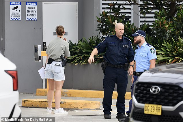 Police were seen stopping and interviewing residents as they left the underground car park