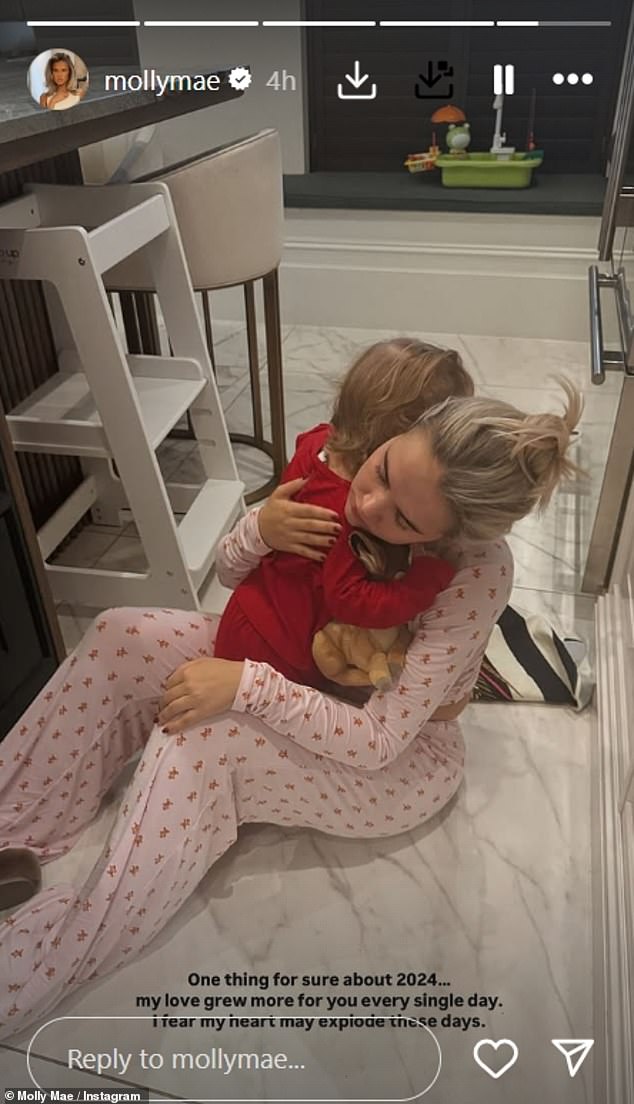 In another photo, Molly hugged her daughter Bambi and added: 'One thing is certain about 2024... my love for you grew stronger every day. I feel like my heart might explode these days.”