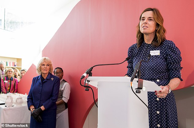 Queen Camilla looks on as Dame Cally Palmer gives a speech during a visit to Maggies at The Royal Marsden on February 6, 2020