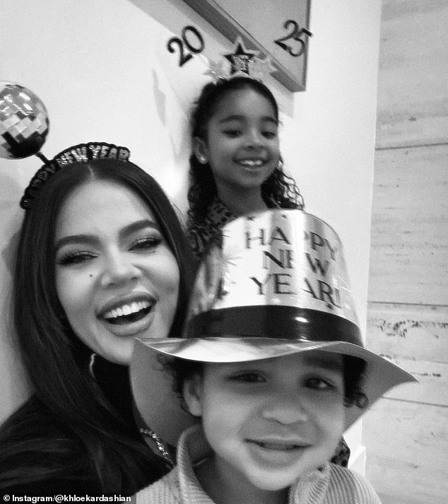 The family trio – Khloe, Tatum, two, and True, six – smile for a black-and-white selfie