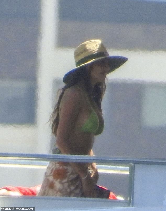 The $6.90 hat, with a green band with the Bunnings logo on it, was an unusual budget item compared to her usually high-end designer wardrobe.