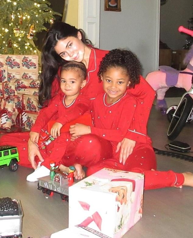 Kylie is pictured with her daughter Stormi, six, and two-year-old son Aire