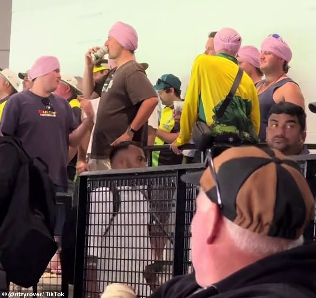 A video of Australian fans wearing headgear during the match (pictured) has been praised for showing a friendlier side to the cricket rivalry with India