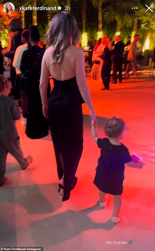 An adorable video showed Kate, who looked sensational in a black halter neck and skirt combo, as she held hands with her son Cree, four, and daughter Shae, 18 months