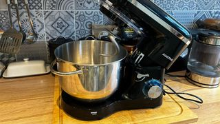 An Aucma stand mixer on a kitchen worktop