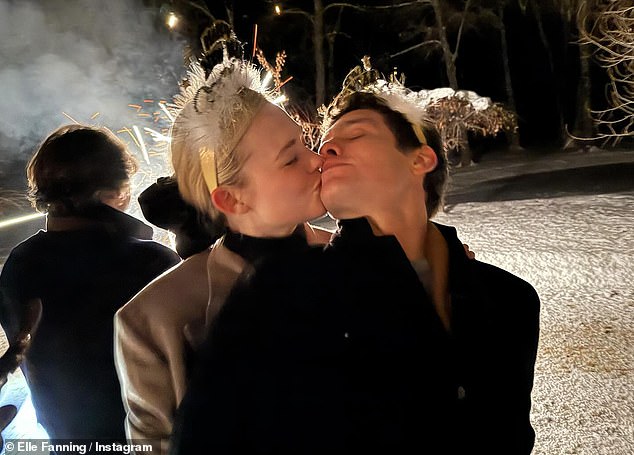 The Maleficent star, 26, and her Rolling Stone CEO, 34, looked in love as she planted kisses on him