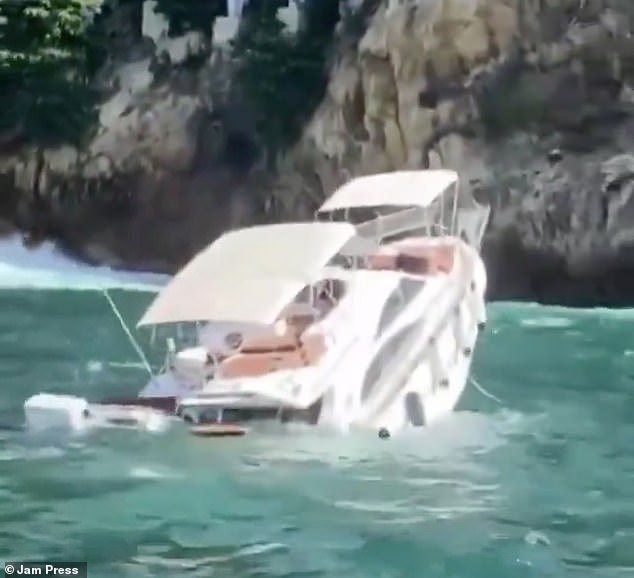 The empty yacht was later seen in footage almost vertically as it sank into the blue waters