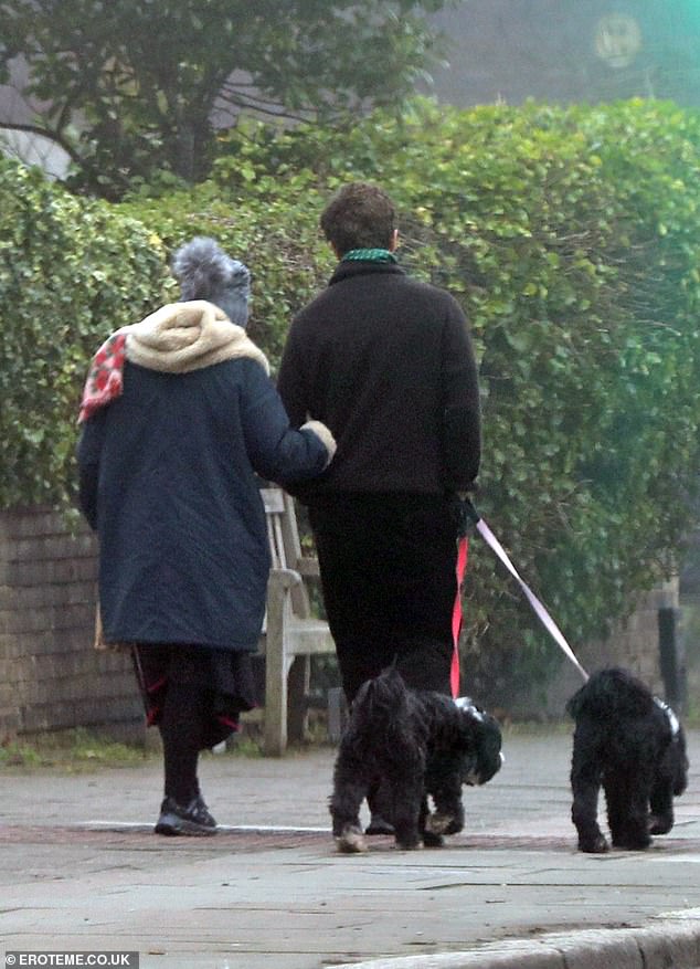 Linking arms, the couple enjoyed a romantic morning walk