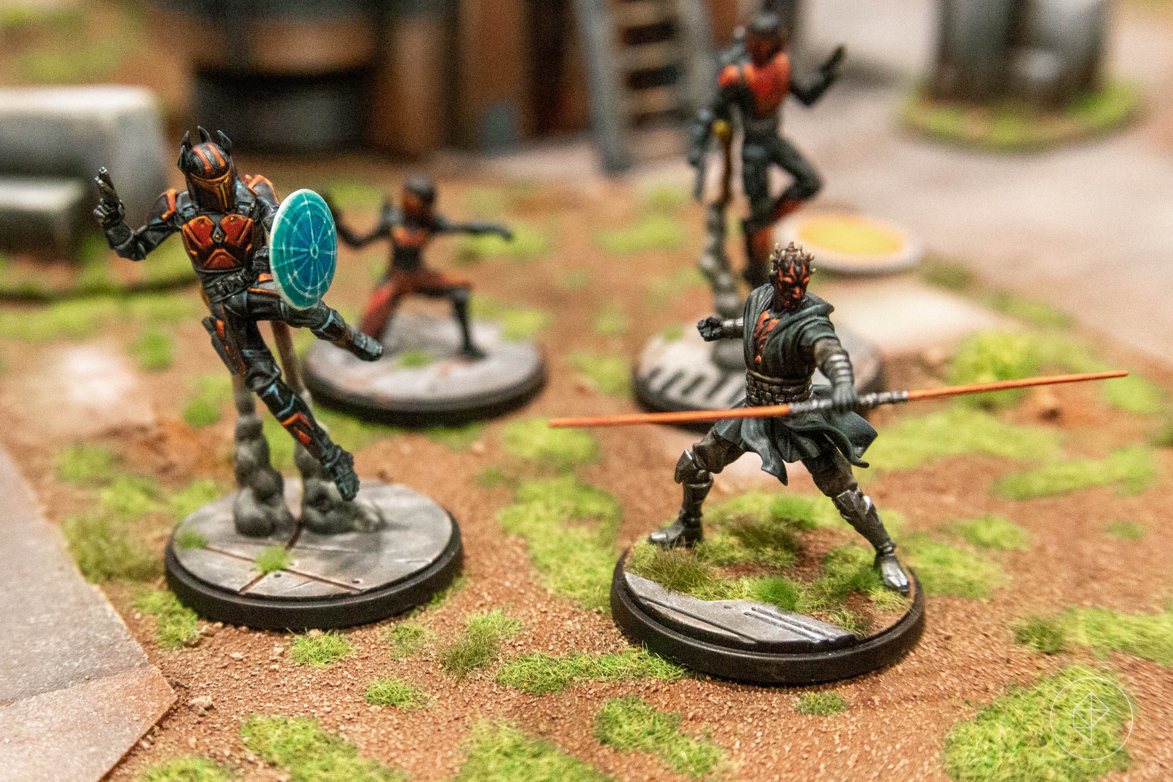 A collection of black and red miniatures, including Darth Maul and Gar Saxxon, for Star Wars: Shatterpoint.