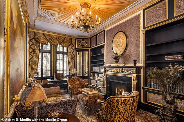 The house also features a library - which Ivana used as an office - furnished with leopard print furniture and a gold fireplace