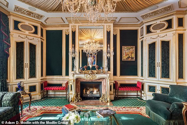 The mansion's decor is reminiscent of a step back into the '80s, with gold fixtures and ornate moldings throughout the home