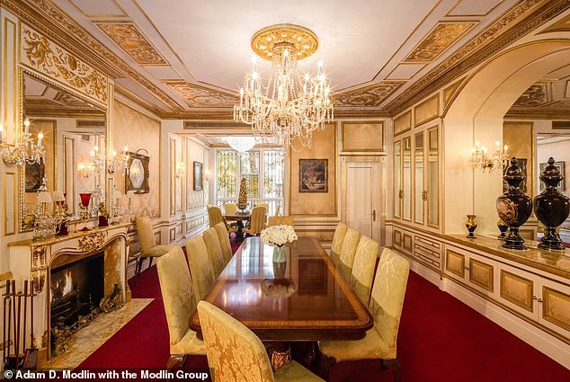 The Versailles-inspired dining room features a floor-to-ceiling window overlooking the private courtyard