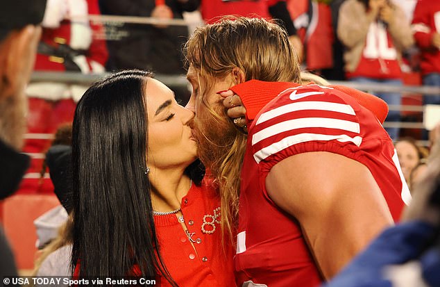 Claire and George, who married in April 2019, share a public kiss during a match in December last year