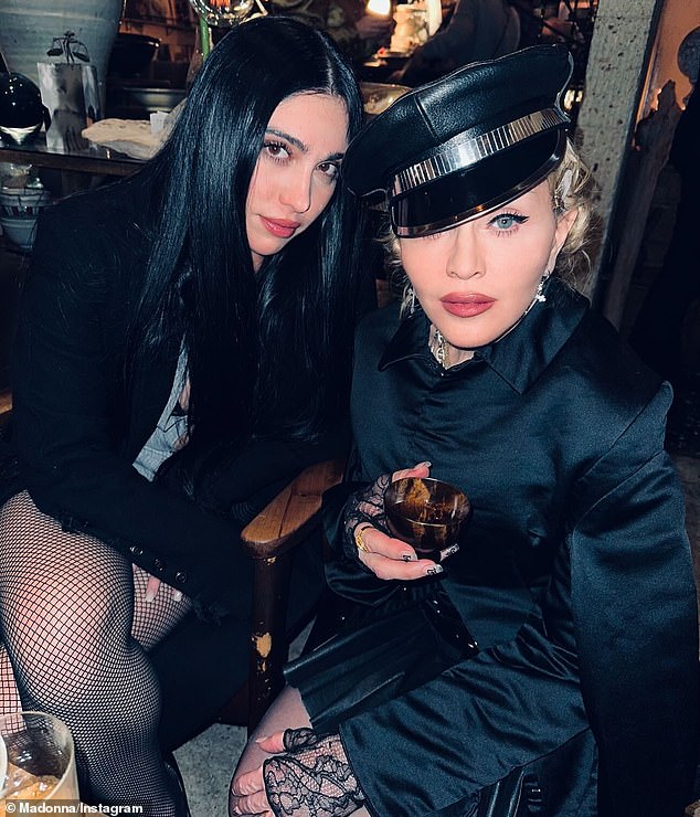 She posed next to her daughter Lourdes – who she shares with her ex-partner, actor Carlos Leon – as she modeled a black satin mini dress as a chic hat