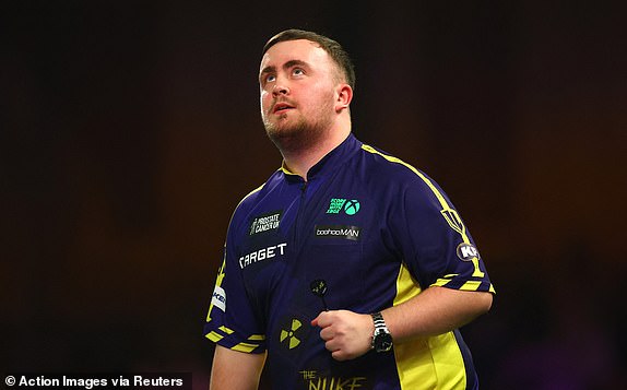 Darts - PDC World Darts Championship 2025 - Alexandra Palace, London, Great Britain - January 1, 2025 Luke Littler reacts during his quarter-final against Nathan Aspinall Action Images via Reuters/Andrew Boyers