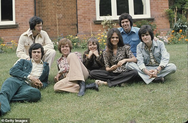 The Osmonds with Wayne, Jay, Merrill, Jimmy, Marie, Alan and Donny on a visit to Britain circa 1974 in England