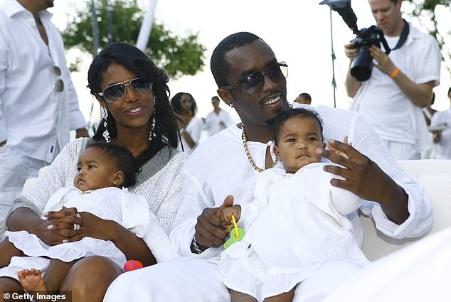 Diddy pictured with his partner Kim Porter and twin daughters D'Lila and Jessie in 2007