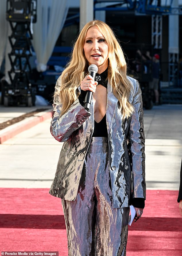 She added a touch of shine with high-waisted metallic trousers and a matching blazer, teamed with pointy heels