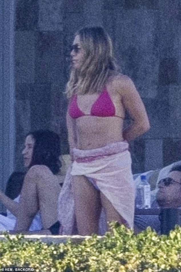 The star wore the same swimsuit she wore 13 years earlier - while on holiday in the same resort with her then fiancé Justin Theroux