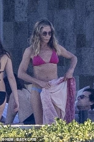 The A-lister was spotted taking off her sarong to reveal her toned physique