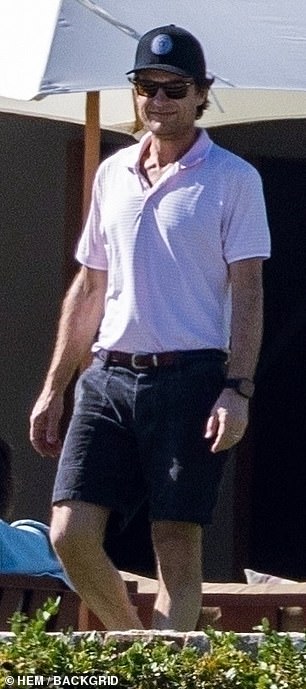 Jason looked handsome as he walked around in a polo shirt and shorts