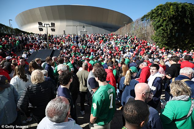 Thousands still attend the college football game, despite many being forced to sell their tickets