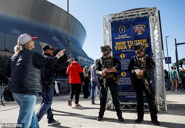 Security personnel stand guard outside the Caesars Superdome before the 2025 Sugar Bowl following the deadly New Orleans truck crash