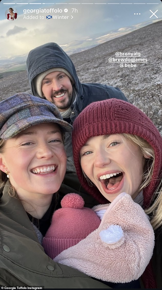 Georgia and James, who is from Aberdeenshire, also appeared at the Cluny Christmas Carols at Cluny Castle in December (pictured with Cosmo's wife Bronya)