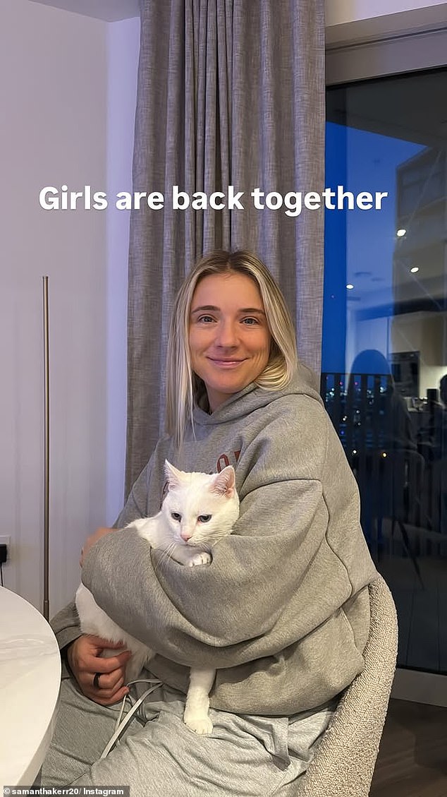 Kerr, 31, posted to Instagram a story showing her fiancé Kristie Mewis and the couple's cat (pictured) at home