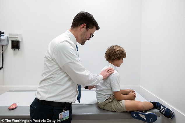 Dr. Gregory Tasian, a pediatric urologist at Children's Hospital of Pennsylvania, checks for kidney stones in a nine-year-old patient