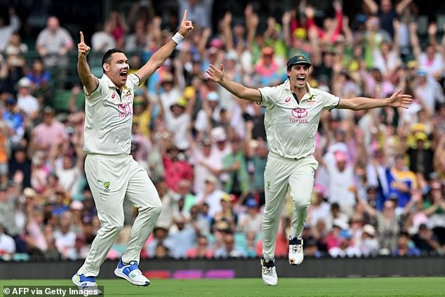 Had the dismissal stood, Scott Boland (pictured left, on appeal for the wicket with Pat Cummins) would have taken two scalps in two balls