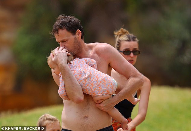 The Nine News Melbourne co-host appeared to be having the time of his life as he showed off his muscular frame and bulging biceps while embracing his dad duties