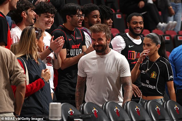 Former England player David, who is now co-owner of Inter Miami football club, looked cheerful as he was greeted with cheers as he walked onto the pitch.