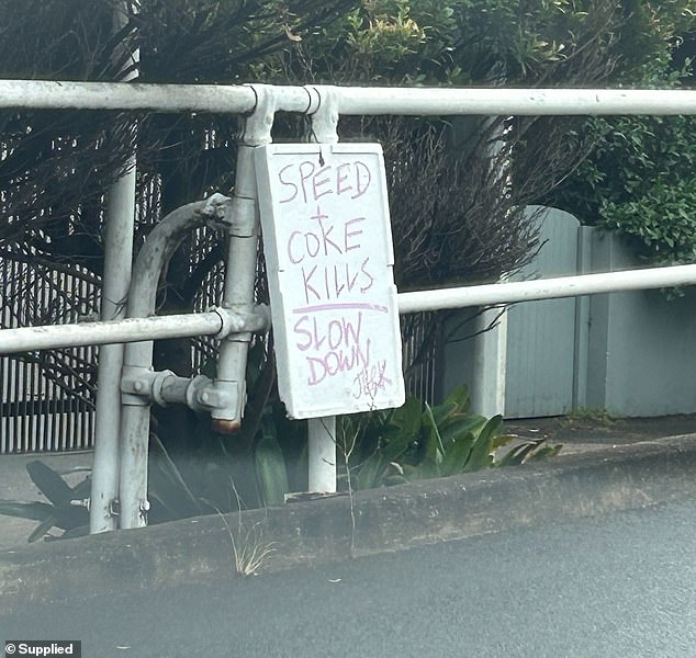 A warning sign has been placed at the scene of the crash in Watsons Bay