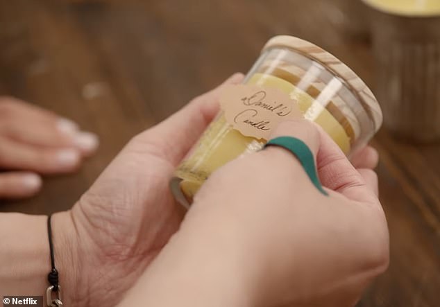 The Duchess of Sussex, 43, is seen writing labels for homemade candles, possibly for her lifestyle brand American Riviera Orchard which she launched in 2024, in a teaser clip for her eight-episode series 'With Love, Meghan'