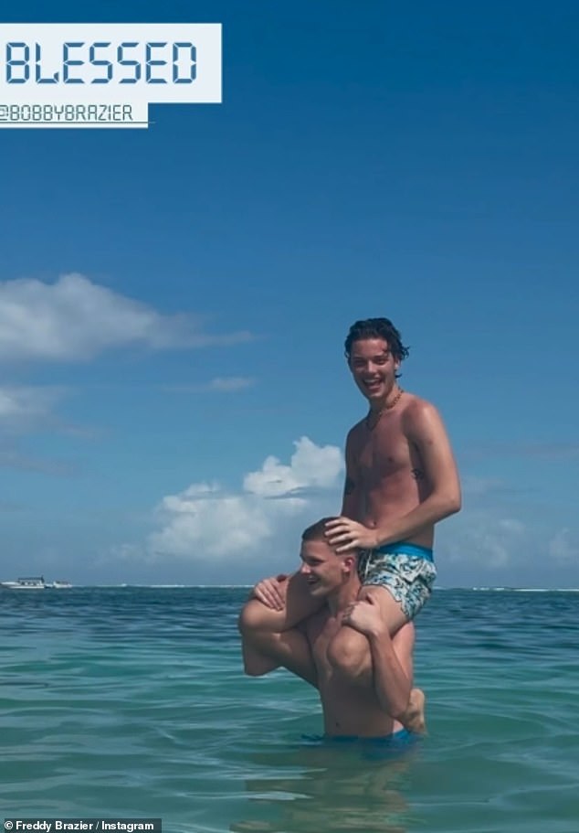 Freddie also shared a sun-kissed photo as he splashed around in the ocean with brother Bobby on his shoulders