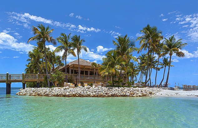 Yoga paddleboarding is offered as a spa wellness therapy on Little Palm Island, possibly the chicest resort in the Florida Keys