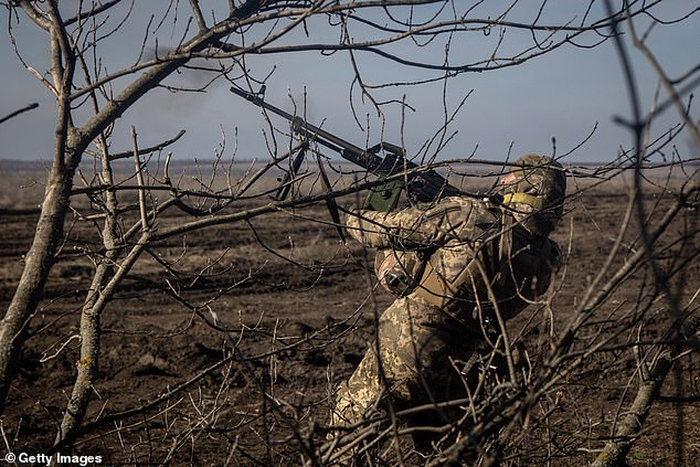 A member of the 72nd Anti-Air Unit of the Ukrainian Brigade fires overhead at a Russian Zala reconnaissance drone near Marinka, Ukraine, on February 23, 2024