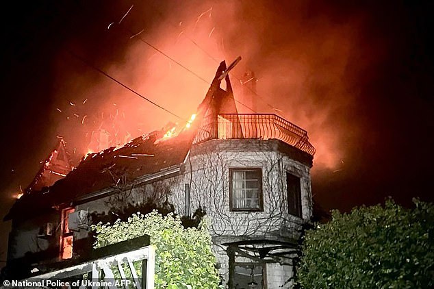 This distribution photo, taken and released by the National Police of Ukraine on November 29, 2024, shows a burning house after a drone attack on a secret location in the Odesa region