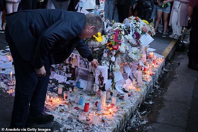 Geoff Payne is seen inspecting tributes to Liam outside the hotel. The family is said to have excluded Roger Nores from attending the singer's funeral