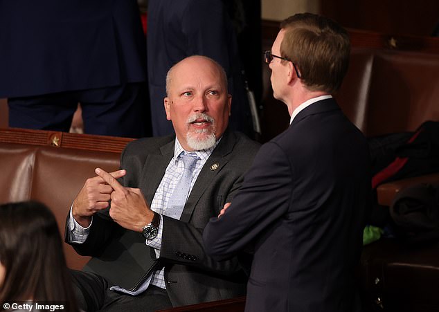 Rep. Chip Roy (L) talks to Rep. Dusty Johnson (R-SD) as they arrive for the first day of the 119th Congress in the House Chamber of the US Capitol Building on January 3, 2025 in Washington, DC.