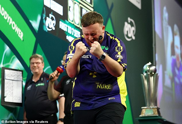 He roared after pinning double 16 before tears started streaming down the stage