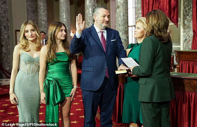 Harris takes the oath of office before Republican Senator Ted Cruz as his family looks on during a ceremonial swearing-in ceremony