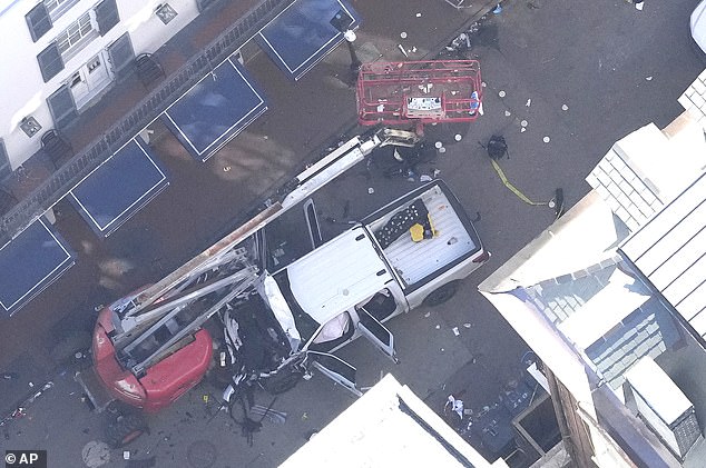 Investigators head to the scene after a person drove a vehicle into a crowd at Canal and Bourbon Street in New Orleans earlier on New Year's Day